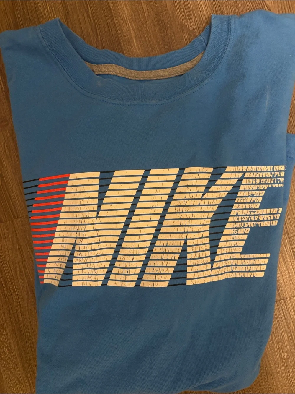 Nike Light Blue Tee with Striped White & Red Logo